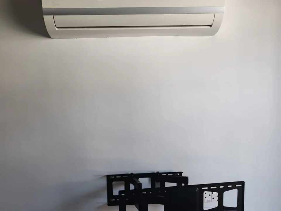 Television wall bracket fitted to an interior wall before the screen is mounted
