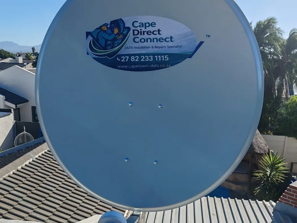 Satellite dish mounted on a roof with its bracket and cabling