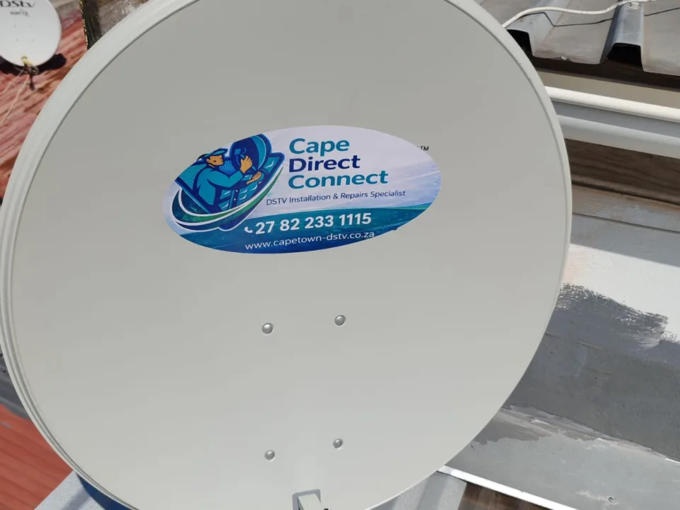 Satellite dish mounted on a roof with its bracket and cabling